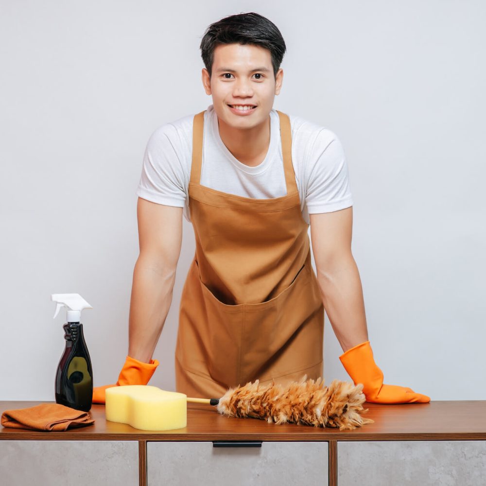 young-man-and-cleaning-equipment-on-furniture-at-h-2021-09-04-01-59-24-utc.jpg